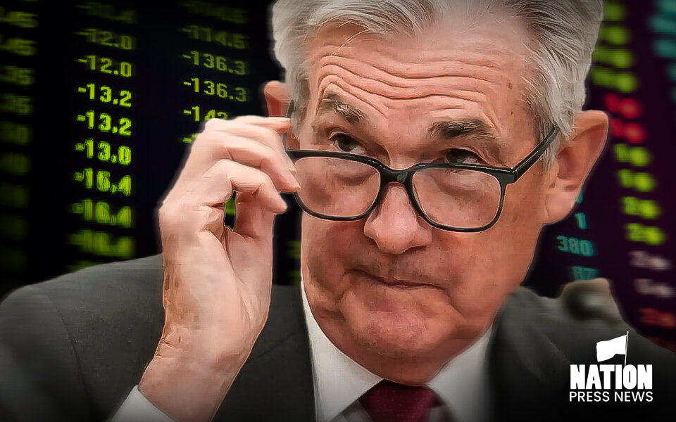 Stock futures slide to start week with more earnings and a powell speech ahead